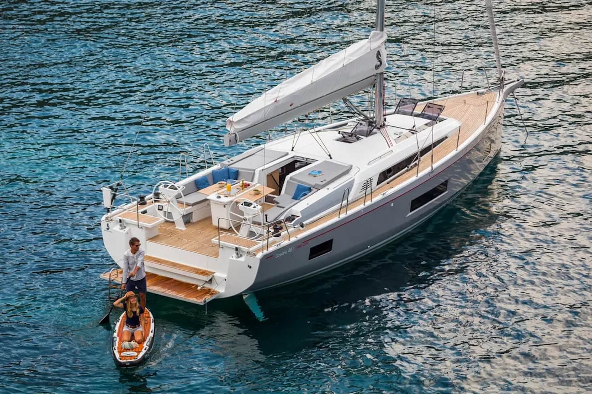 Couple enjoying a sunny day on a sailing yacht near Los Angeles.